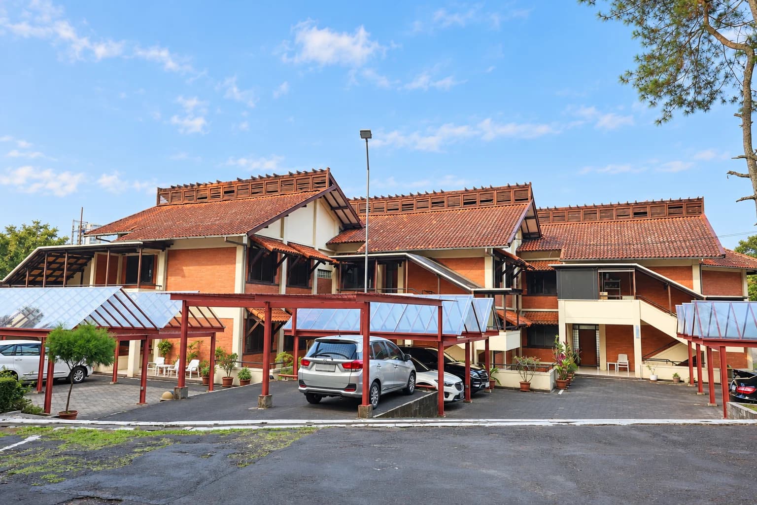 AI-edited photo of Villa 3’s brick facades, tiled roofs and covered parking