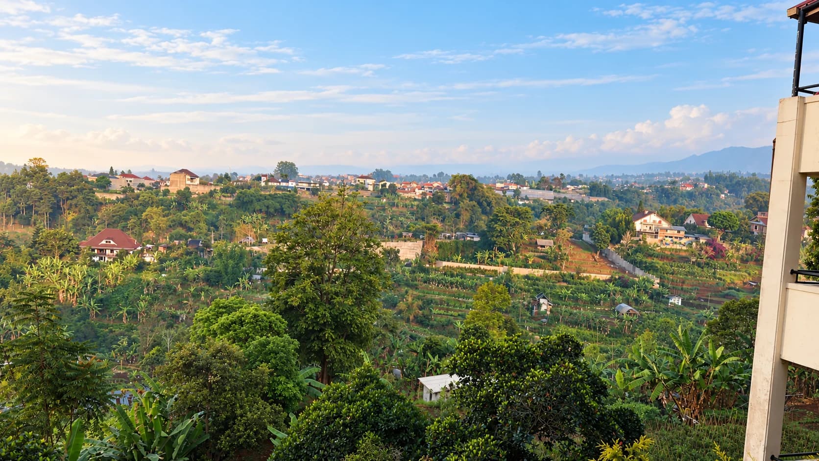 AI-edited panorama of the green valley, cultivated fields and local homes seen from Villa 3
